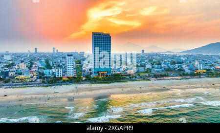 Da Nang, Vietnam - April 15th, 2024: Aerial view of Da Nang beach, Vietnam at sunset sky which is one of the most beautiful beach in the world. Stock Photo