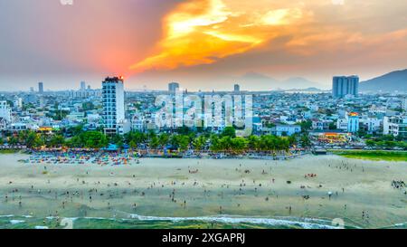 Da Nang, Vietnam - April 15th, 2024: Aerial view of Da Nang beach, Vietnam at sunset sky which is one of the most beautiful beach in the world. Stock Photo