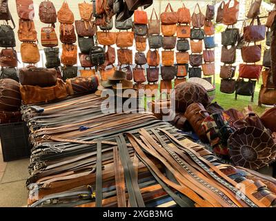 Leather belts, bags and hats for sale at the Open Market held on Thursdays in Javea, Alicante Province, Spain Stock Photo