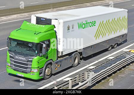 Waitrose supermarket retail business food supply chain store delivery Scania hgv lorry truck & driver rigid body trailer M25 motorway road England UK Stock Photo