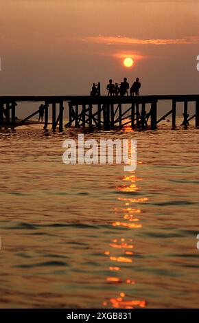 Tourist on a jetty, Sipadan, Malaysia, Celebes Sea Stock Photo