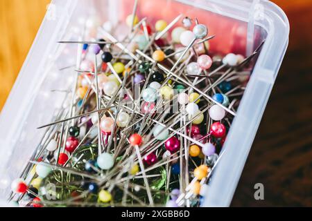 Close-up of a box of sewing pins with colorful round head - Sewing supplies Stock Photo