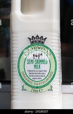 Organic semi-skimmed milk in plastic bottle from the Goodwood Estate Home Farm, farm shop in West Sussex, England, UK Stock Photo