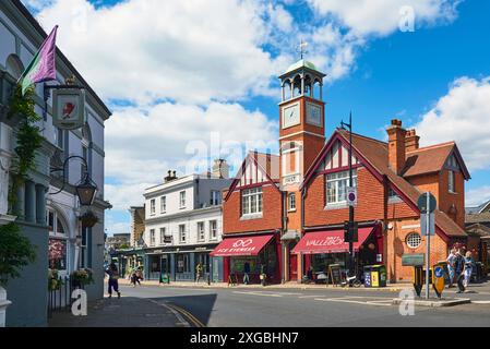 The High Street at Wimbledon Village, Borough of Merton, Greater London UK, with clock tower and pedestrians Stock Photo