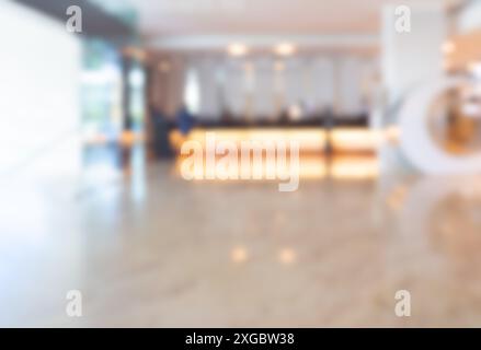 Abstract blur luxury hotel lobby luxury interior for background, decoration with reception counter with lighting, marble floors. Blurred scene front d Stock Photo