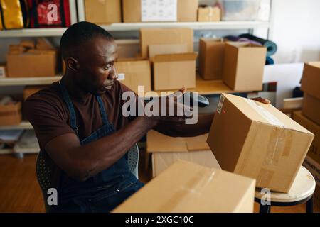 Worker Scanning Barcode On Order Stock Photo
