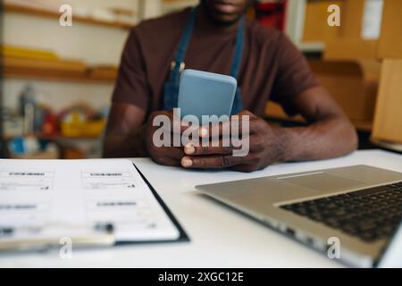 Man Using His Smartphone At Work Stock Photo