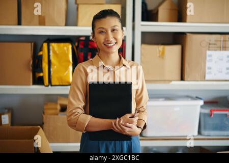 Female Worker Working In Warehouse Stock Photo
