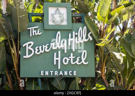 Beverly Hills Hotel Sign and Entrance in California Surrounded by Palm Trees Stock Photo