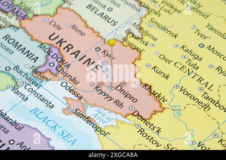 Close up to a Dnipro city with a yellow pin needle into Ukraine country political map Stock Photo