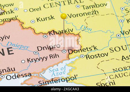 Close up to a Donetsk city with a yellow pin needle into Ukraine country political map Stock Photo