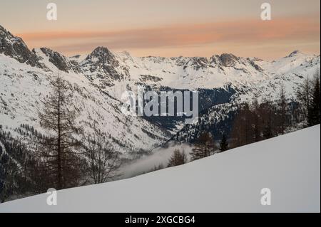 France, Haute Savoie, Mont Blanc massif, Chamonix, Argentières, Grands Montets area, Lognan, from the Sliable area view of the Aiguilles Rouges and the Tour valley under low clouds at sunrise Stock Photo