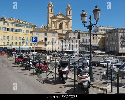 Special motorbike parking spaces with sign in the old port of Bastia, Corsica, France Stock Photo