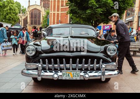 Passers by admire the stunning form of a Hudson Pacemaker Coupe Custom ...