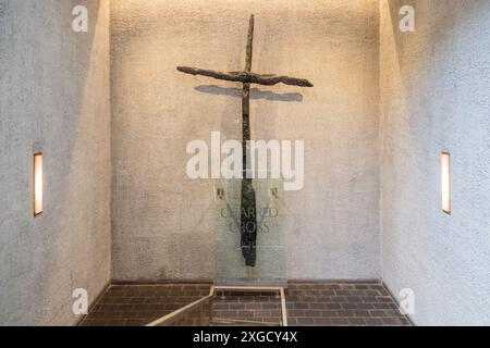 The charred cross in Coventry Cathedral, formed from WWII ruins, symbolizes resilience, forgiveness, and hope amid destruction. Stock Photo