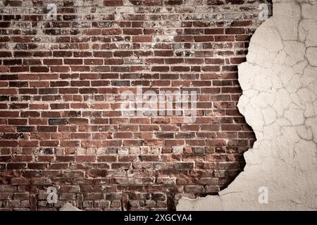 Vintage brick wall with cracked and crumbling stucco Stock Photo