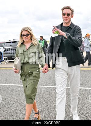 Towcester, UK. 07th July, 2024. Stuart Broad with his wife Mollie King arrive into the Paddock area on Race Day at the Formula 1 Qatar Airways British Grand Prix at Silverstone, Towcester, Northamptonshire, UK. Credit: LFP/Alamy Live News Stock Photo