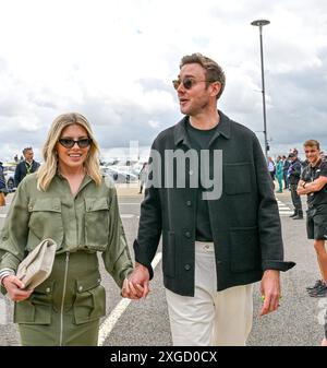 Towcester, UK. 07th July, 2024. Stuart Broad with his wife Mollie King arrive into the Paddock area on Race Day at the Formula 1 Qatar Airways British Grand Prix at Silverstone, Towcester, Northamptonshire, UK. Credit: LFP/Alamy Live News Stock Photo