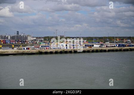 Shipping containers and vehicles on the dockside in the port of Zeebrugge. Stock Photo