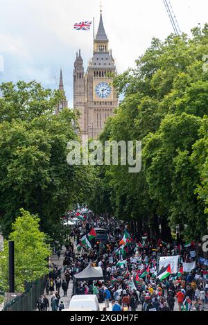 Pro Palestine protesters gathering on Victoria Embankment below the Elizabeth Tower of the Palace of Westminster, government, Parliament Stock Photo