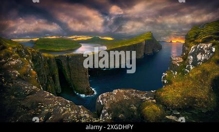 Incredible view of Sorvagsvatn lake on cliffs of Vagar island in sunset ...