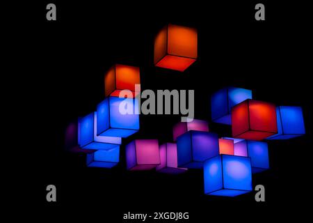multicolour cubes floating in the air in the dark background Stock Photo
