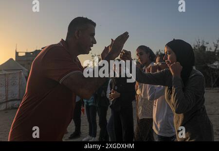 Gaza. 5th July, 2024. Palestinian girls attend boxing training in the refugee camp in Mawasi of Khan Younis in the south of Gaza, on July 5, 2024. Credit: Rizek Abdeljawad/Xinhua/Alamy Live News Stock Photo