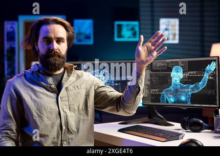 Rogue AI taking control of software developer, moving his limbs, starting robot uprising posing risk to mankind. Artificial intelligence possessing engineer, spiraling out of control Stock Photo