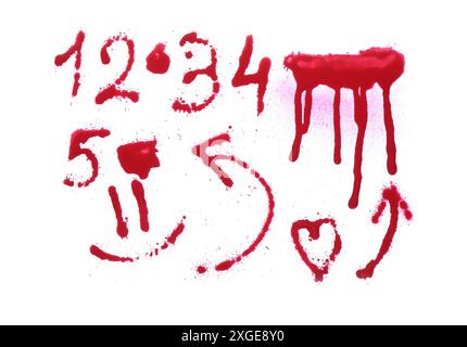 Different symbols made with red spray paint isolated on white, top view Stock Photo