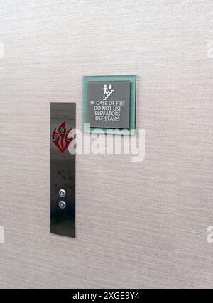 In case of fire warning outside a hotel elevator Stock Photo