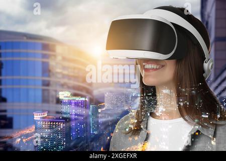 Developer using virtual reality headset in project. Modern technology. Double exposure of woman and cityscape Stock Photo