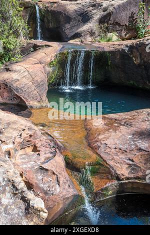 The sandstone geology, the many crystal clear rockpools and cascades directly above Rainbow Falls on the Blackdown Tablelands are simply stunning. Stock Photo