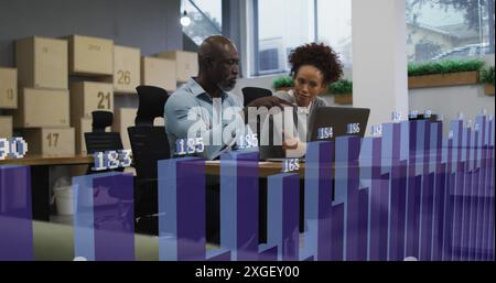 Image of statistical data processing over diverse man and woman discussing over laptop at office Stock Photo
