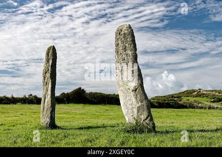 Penrhos Feilw prehistoric standing stone pair near Holyhead, Anglesey, Wales. 3m high. Neolithic or Bronze Age. View from N.E. Stock Photo