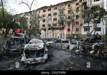 Kyiv, Ukraine. 08th July, 2024. Destroyed cars seen near a damaged residential building. As a result of the mass missile attack of the Russian Army on the territory of Ukraine, 36 people were killed and 140 were injured. Credit: SOPA Images Limited/Alamy Live News Stock Photo