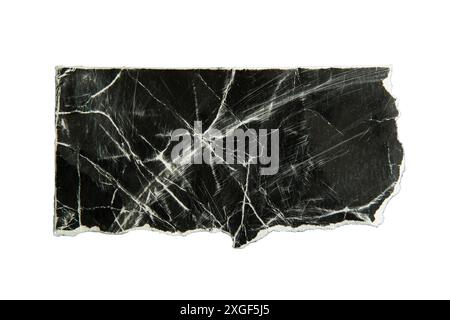 Torn distressed black paper on white background with clipping path Stock Photo