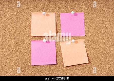 Group of four Blank note on a cork board for adding text and push pin. Mock up Stock Photo