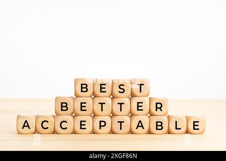 Best, better, acceptable words on wooden blocks on table. Rating concept. White background. Copy space Stock Photo