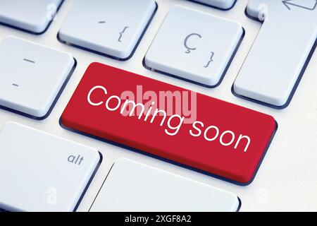 Coming soon phrase on computer Keyboard Key Stock Photo