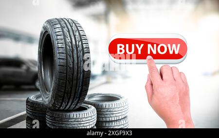 Car tire shop business concept , Hand is pressing red button to buy car tires Stock Photo