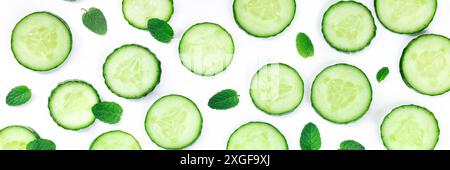 Fresh summer food and drink panorama with cucumber slices and mint on a white background Stock Photo