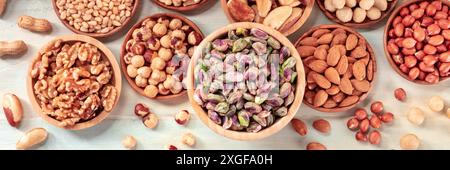 Nut panorama. Various nuts, shot from the top on a rustic background, a panoramic header Stock Photo