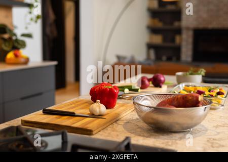 Preparing vegetables, kitchen counter with cutting board, knife, and fresh produce, copy space Stock Photo