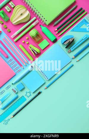 Composition with notebooks and stationery on color background Stock Photo