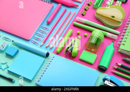 Composition with notebooks and different stationery on color background, closeup Stock Photo