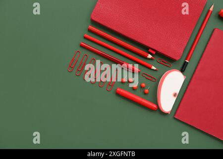 Composition with different stationery on green background Stock Photo