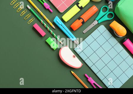 Composition with different stationery on green background Stock Photo