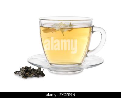 Aromatic jasmine tea in glass cup, flowers and dry leaves isolated on white Stock Photo