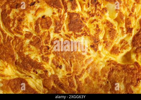 A close-up of a delicious golden-brown surface  beautifully textured, with various shades of yellow and brown, creating an appealing pattern. Backgrou Stock Photo