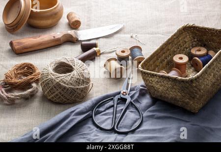 Sewing threads with needles and scissors on a canvas, Uzbekistan, Central Asia, Asia Stock Photo